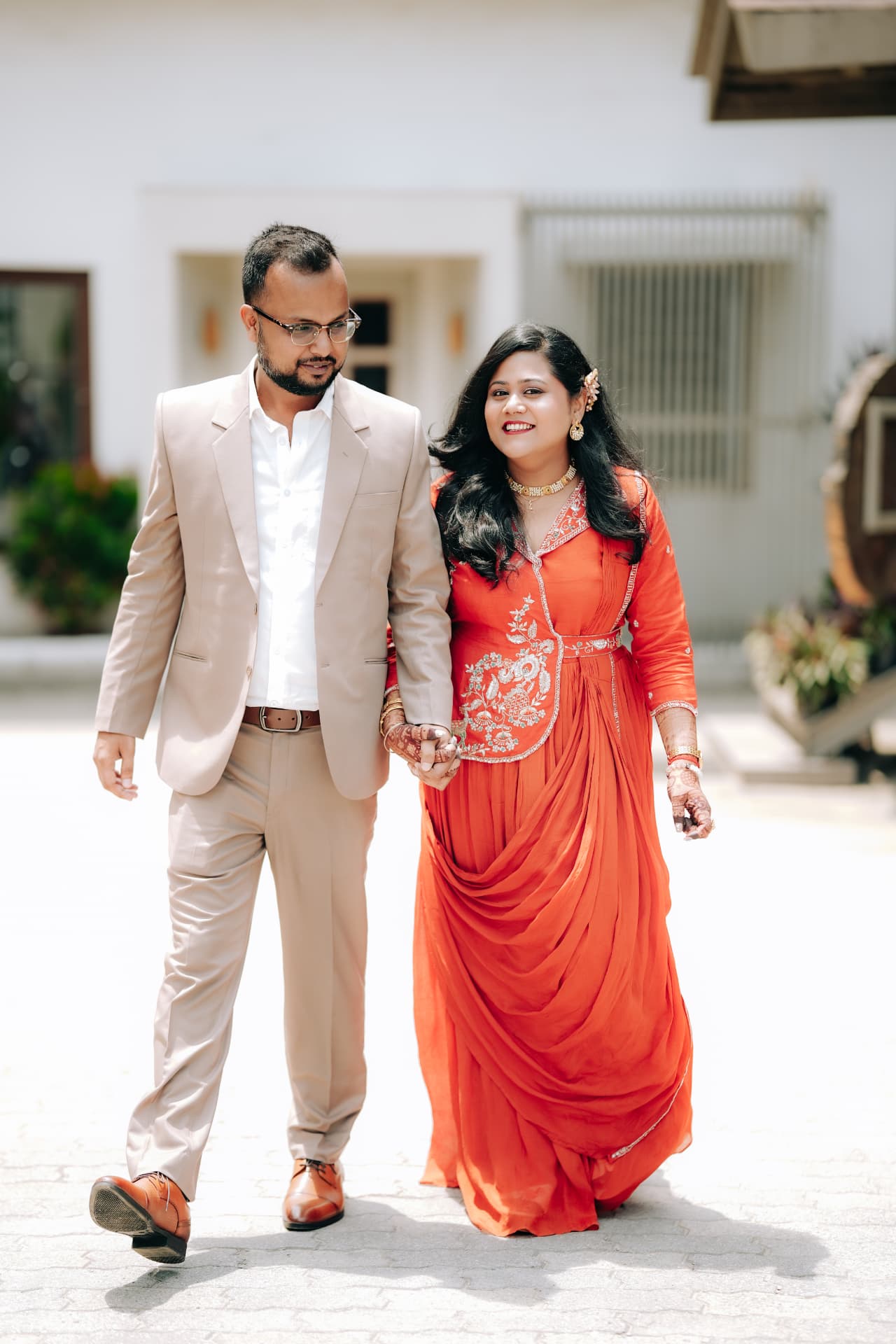 The couple walking hand in hand